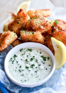 Recipe for Crispy Oven-Fried Fish Bites with Homemade Tartar Sauce is a quick weeknight meal that is kid friendly and so much better than the frozen stuff! | width=